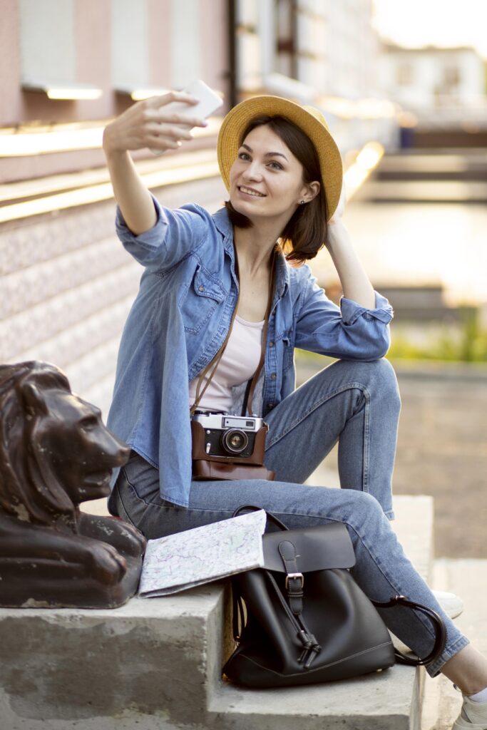 Solo Female Travel: stylish-tourist-taking-selfie-holiday