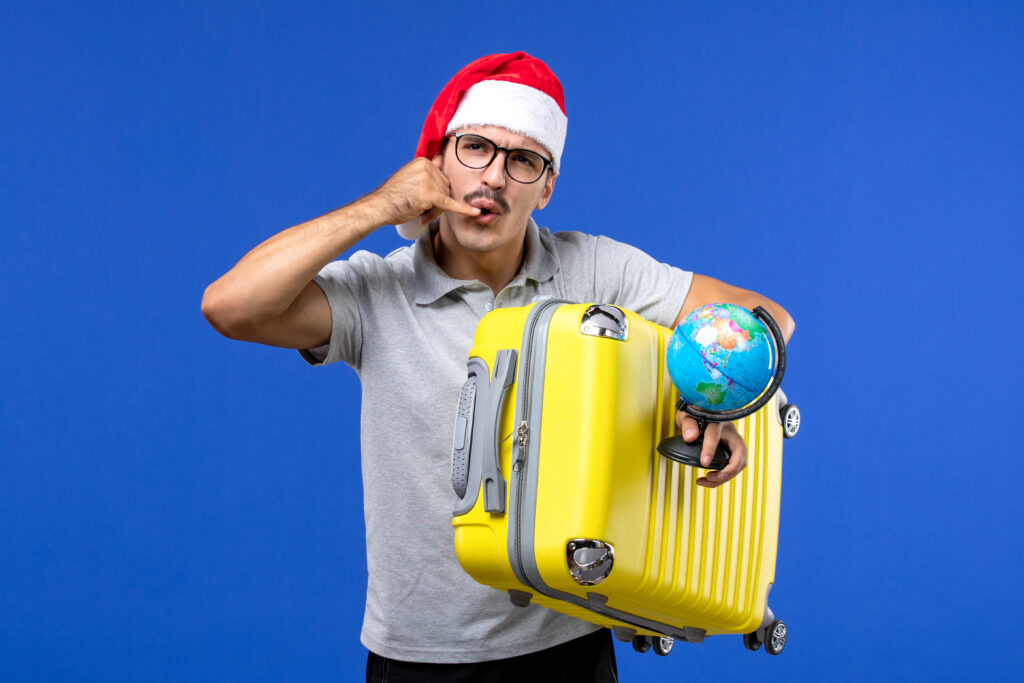 worst countries to visit:
front-view-young-male-holding-globe-yellow-bag-blue-wall-plane-vacation-trip